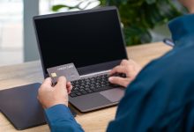 Business professionals analyzing digital payment processing and financial data