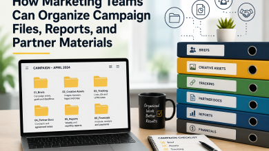 Marketing team campaign file organization workspace with folders, reports, creative assets, tracking documents, and partner materials management on a modern office desk.